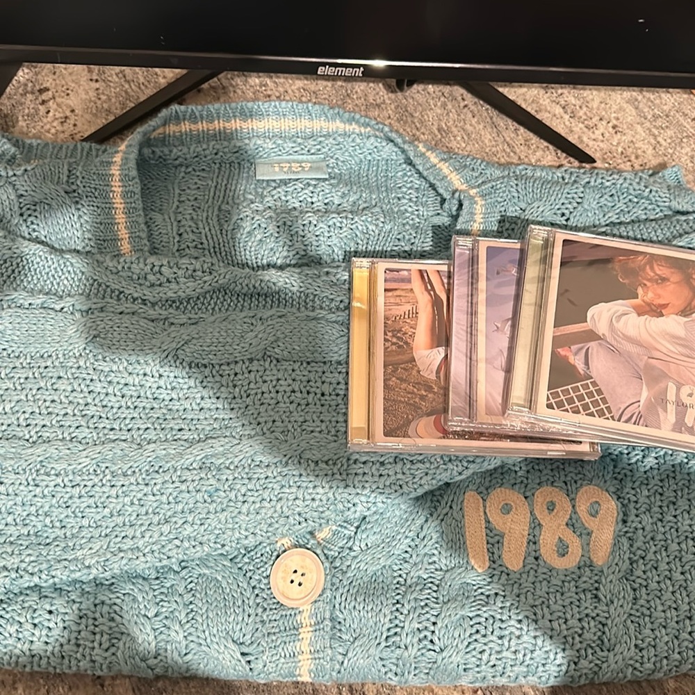 Official 1989 TV Cardigan with the green and blue CDs